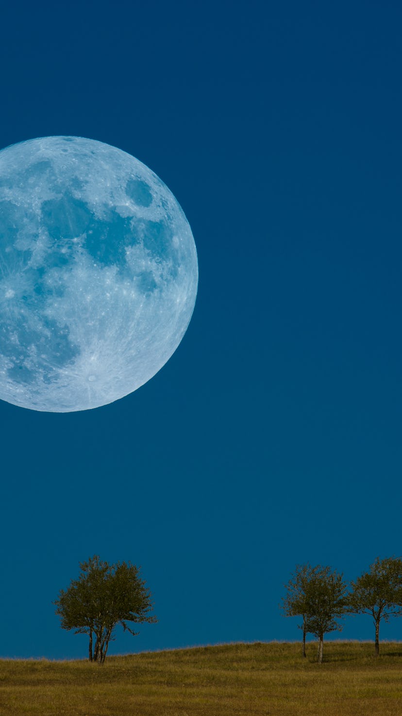 Rare blue full moon on blue sky