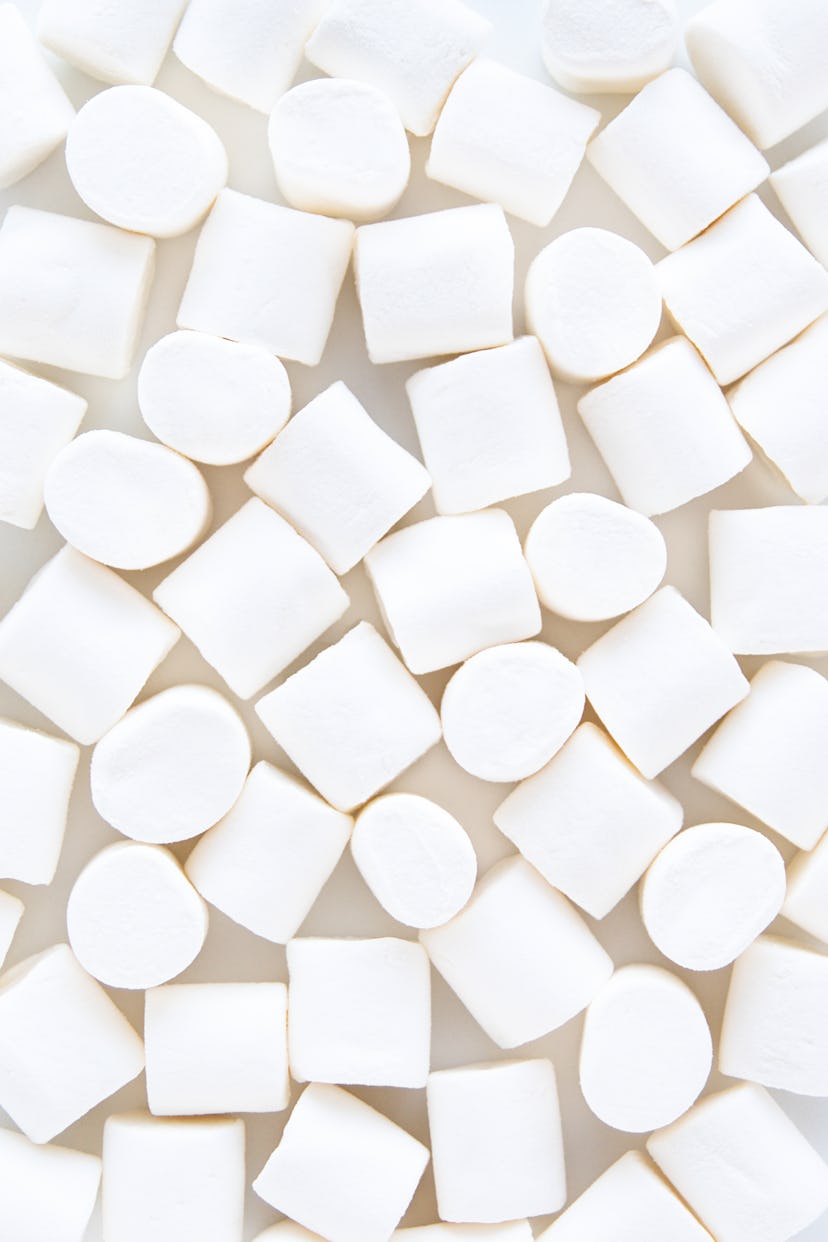White marshmallows on a gray backdrop. A doctor explains that marshmallows are not a sore throat rem...