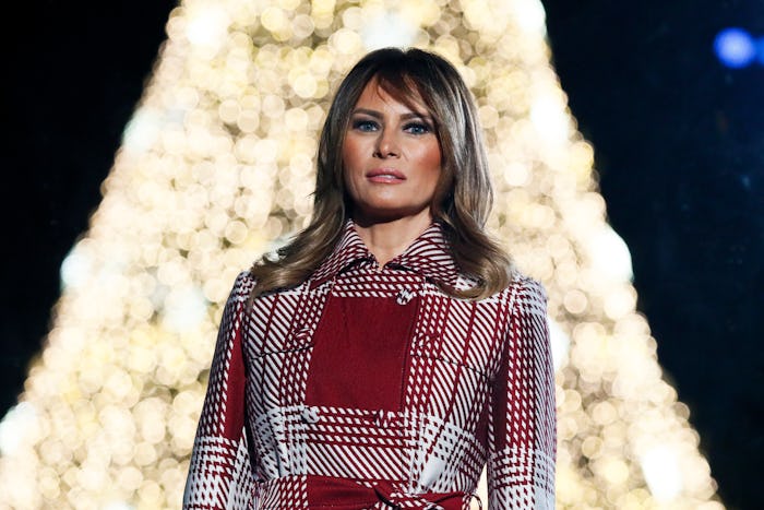melania trump in front of christmas tree