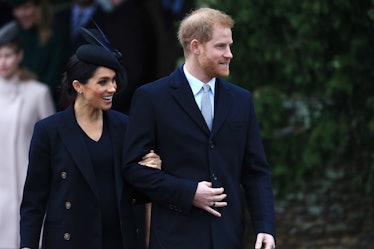 Meghan Markle and Prince Harry step out arm in arm.