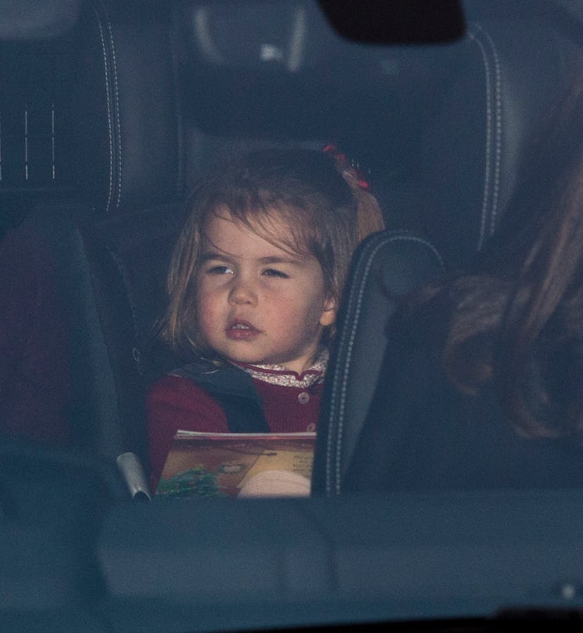 Princess Charlotte wears a sweater in her carseat