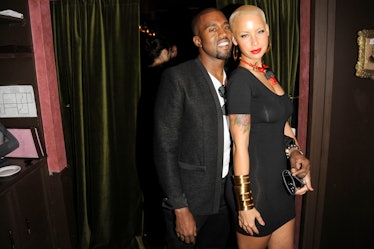 Kanye West and Amber Rose pose for a photo.