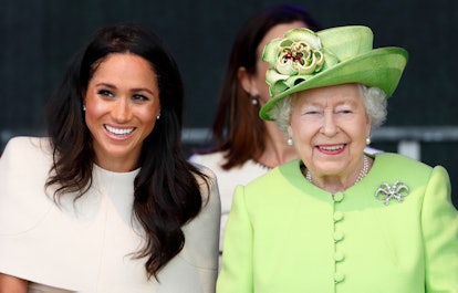 Meghan Markle laughs with the queen.