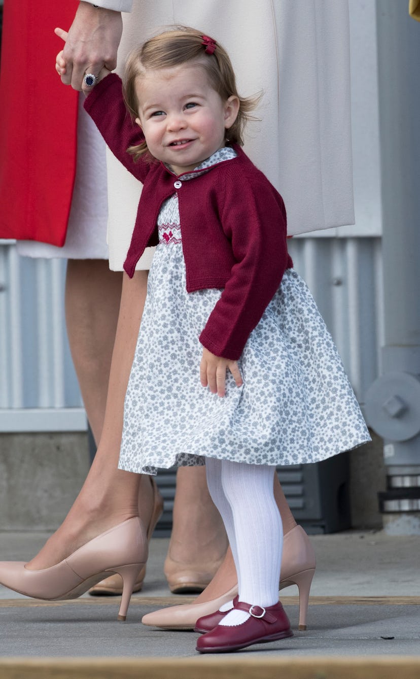 Prince Charlotte wears the color maroon throughout her outfit