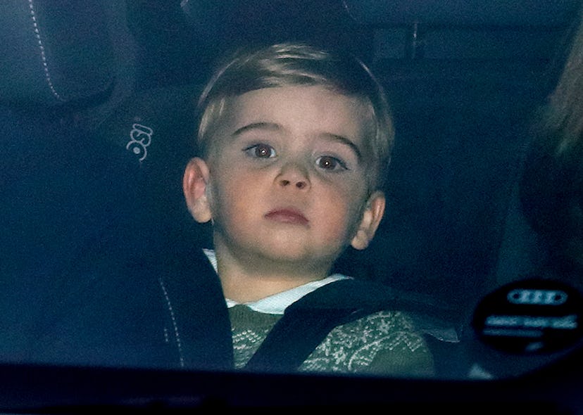 Prince Louis wears a green sweater in the car