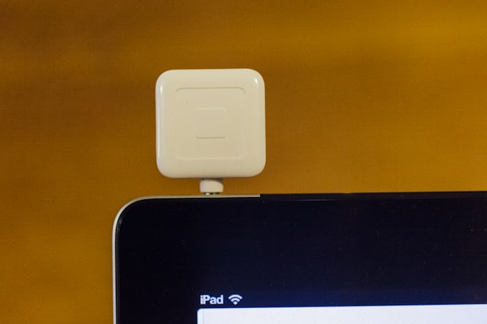 Square credit card dongle.