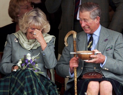 Prince Charles and Camilla Parker Bowles laugh together.