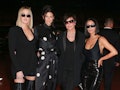 Kris Jenner and her daughters pose for a photo.