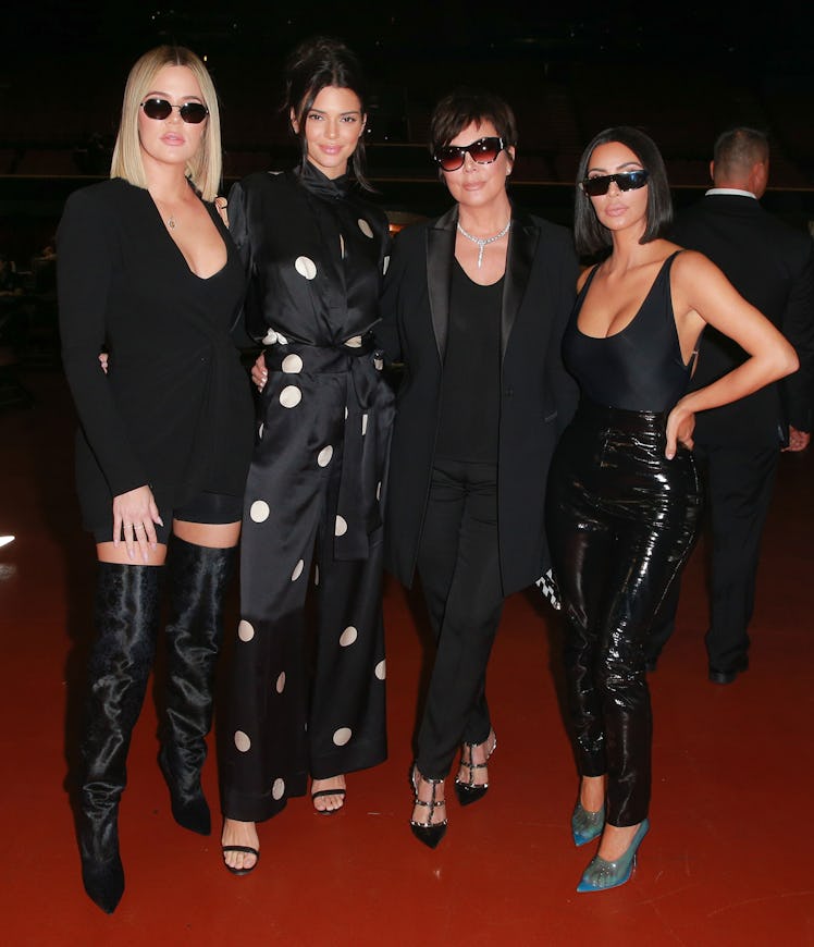 Kris Jenner and her daughters pose for a photo.