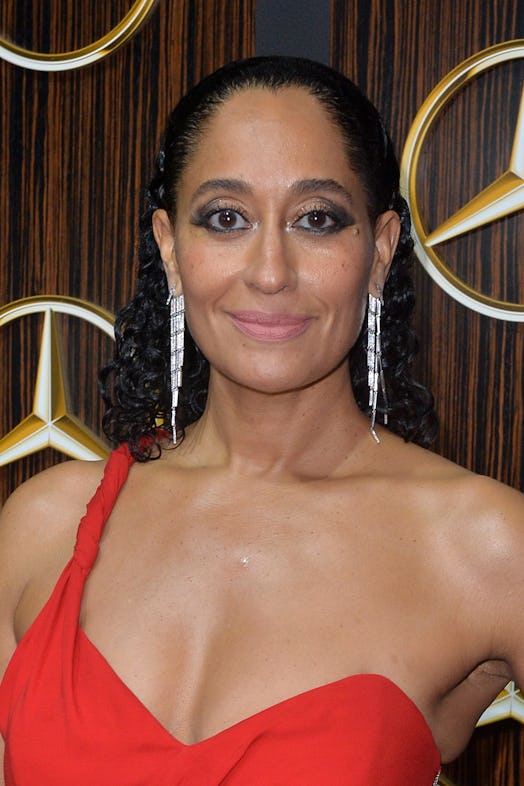 Tracee Ellis Ross in a red evening dress at a mercedes benz event