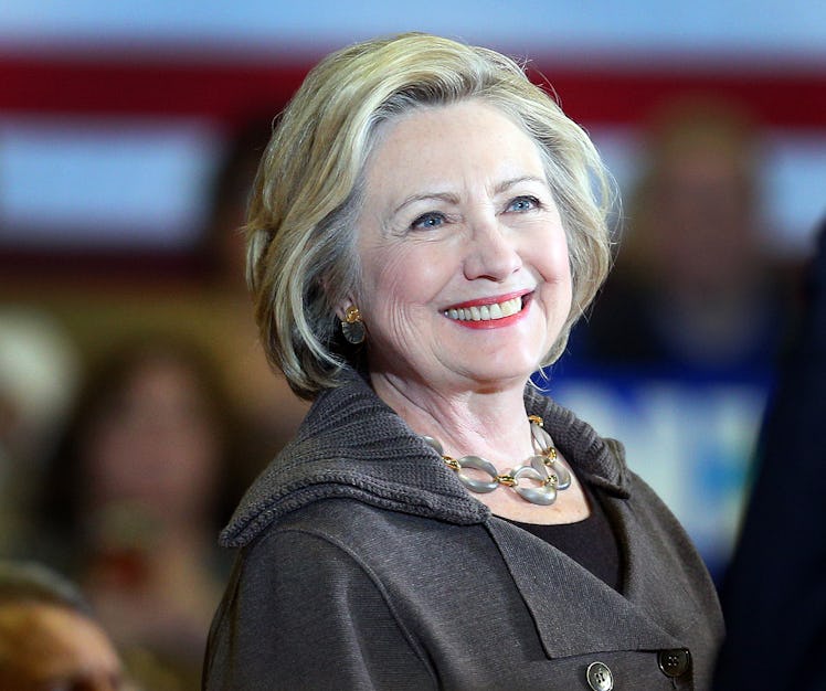 Hilary Clinton flashes a smile.