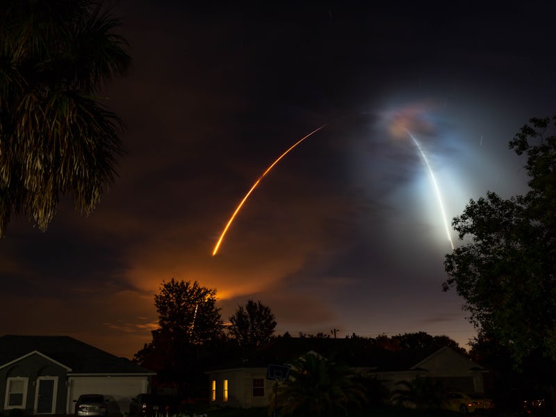 SpaceX rocket launching into space over a night sky.