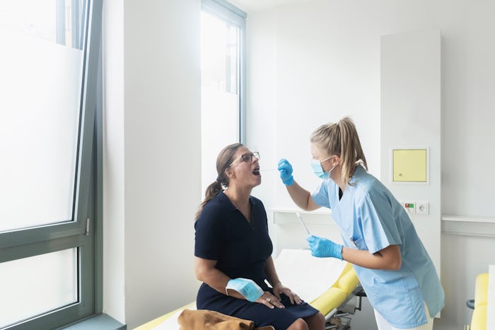 woman getting covid-19 test