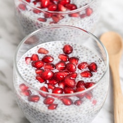 Two cups of chia pudding with pomegranate seeds. Here's what can happen to your body when you have t...