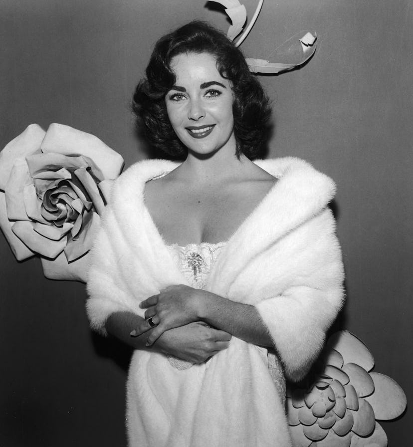 Elizabeth Taylor in a white dress and curls.