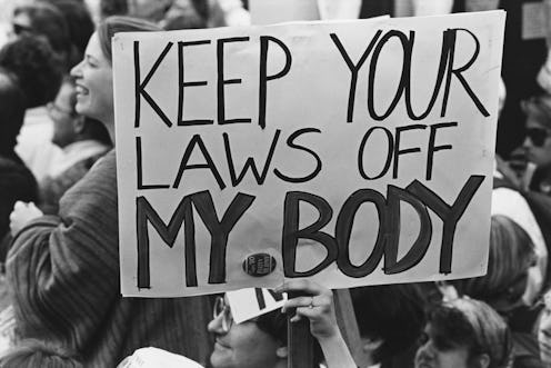 A pro-choice protest sign reading "keep your laws off my body." In this q&a, Whole Woman's Health CE...