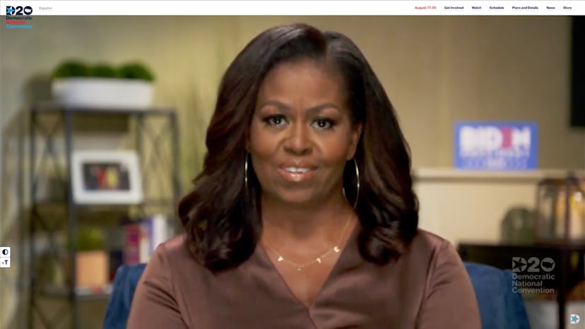 Michelle Obama smiling in a brown satin shirt