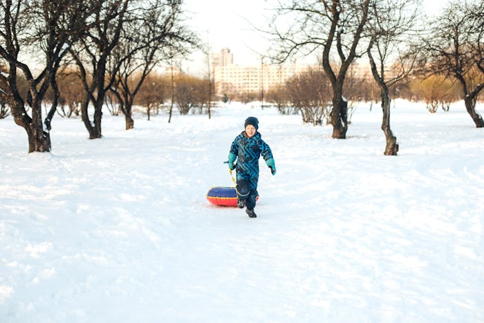 Kid running in snow.