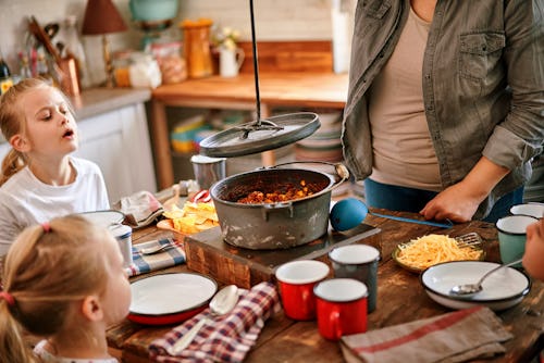 family about to eat chili