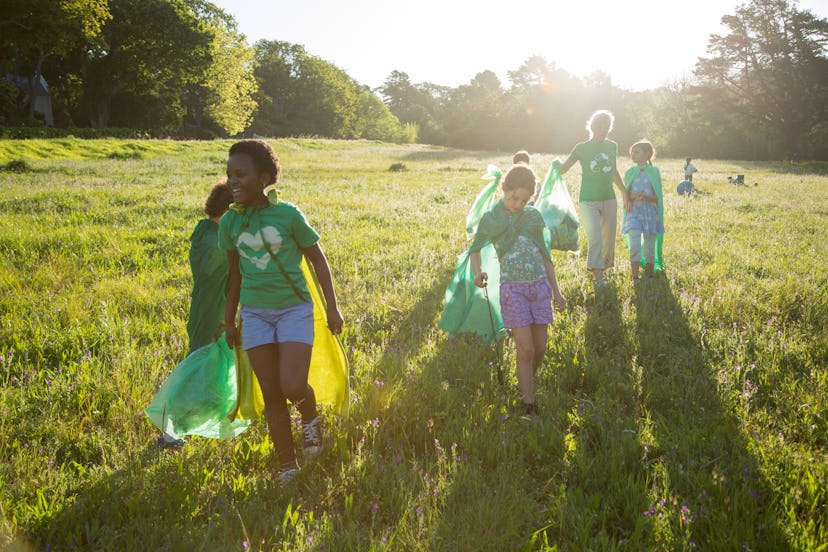 Children volunteering with their community.