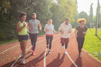 group of people running in sun