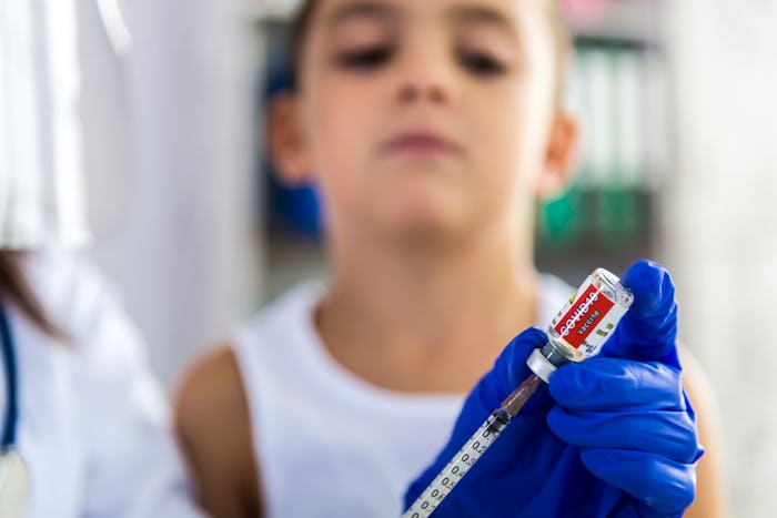 boy waiting to be vaccinated