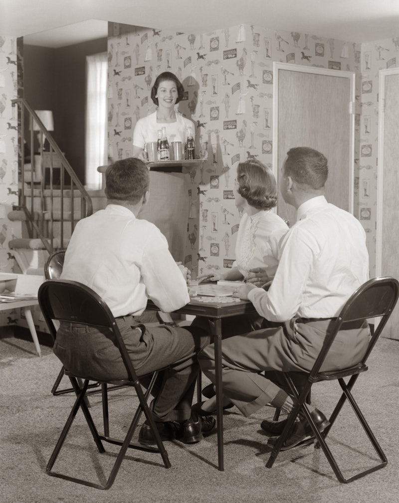 A vintage photo of two couples playing a board game. Experts believe that an isolation bubble to lim...