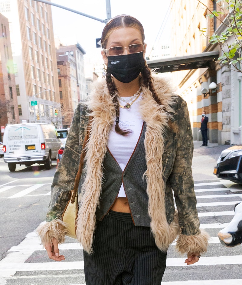 Bella Hadid rocks the color-blocking hair trend, which stylists see as a must-try for winter 2021.