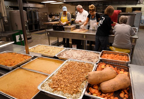 A food kitchen organizes a Thanksgiving Meal. These ideas for charities and ways to give back during...