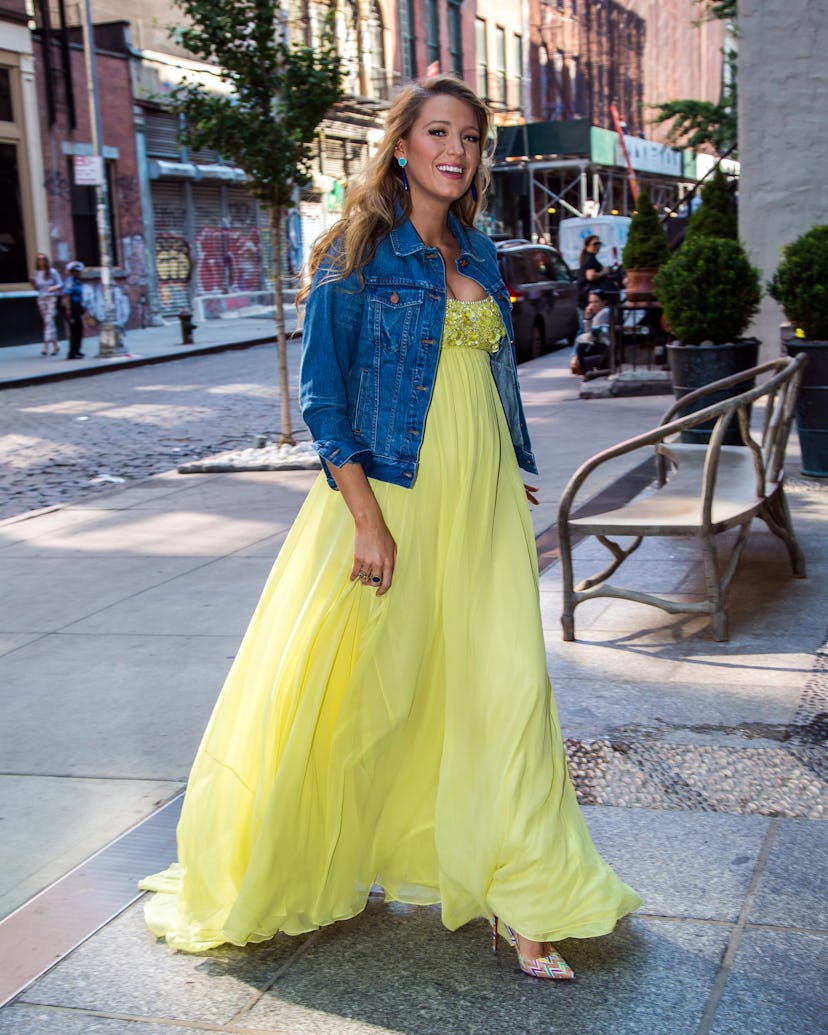 Blake Lively, pregnant, in a flowing yellow dress with a jean jacket on the streets of New York, 201...