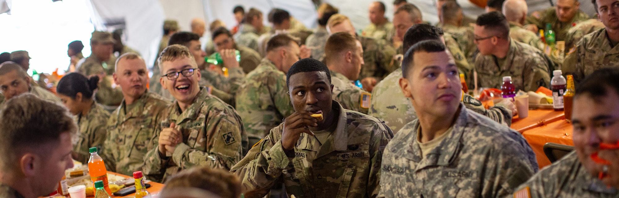 armed service members seated for thanksgiving dinner
