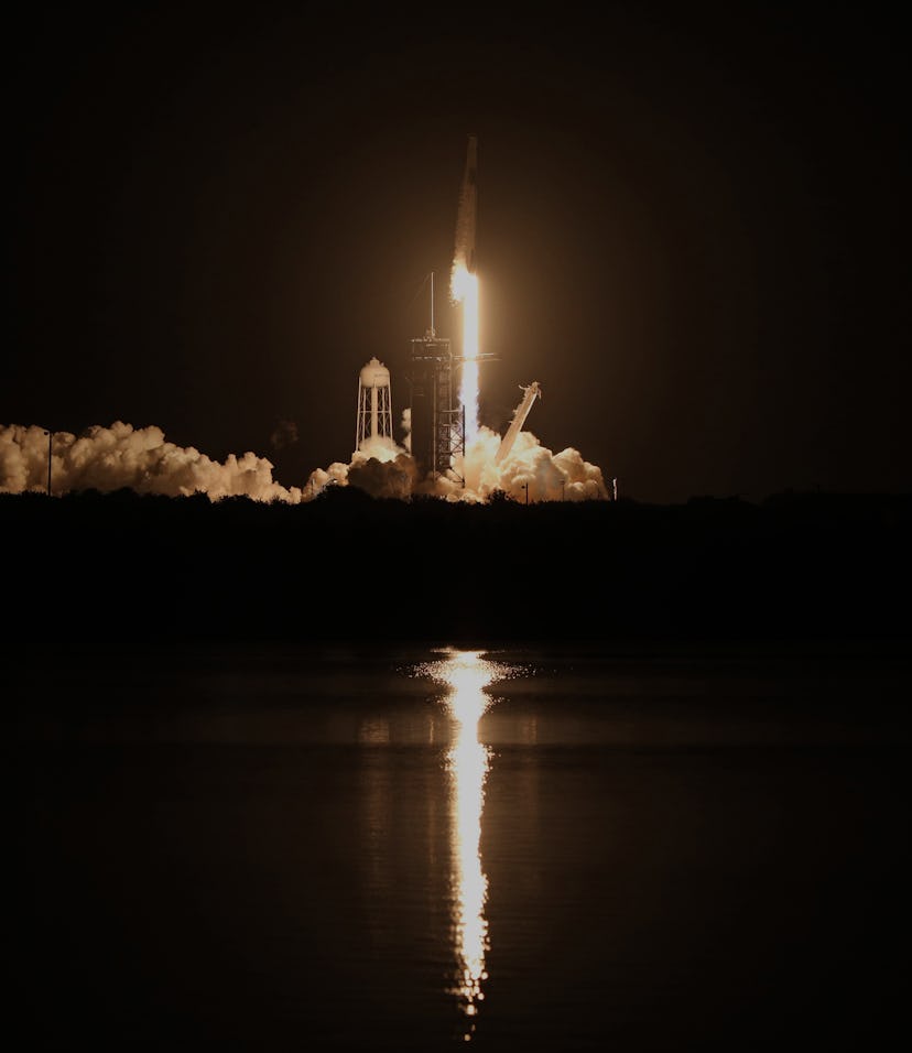 SpaceX rocket taking off from a launch pad.