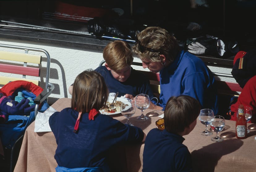 Princess Diana eats with her son Prince Harry in Austria in 1994.