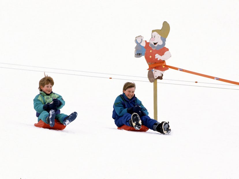 Prince William and Prince Harry enjoy sledding in Austria in 1994.