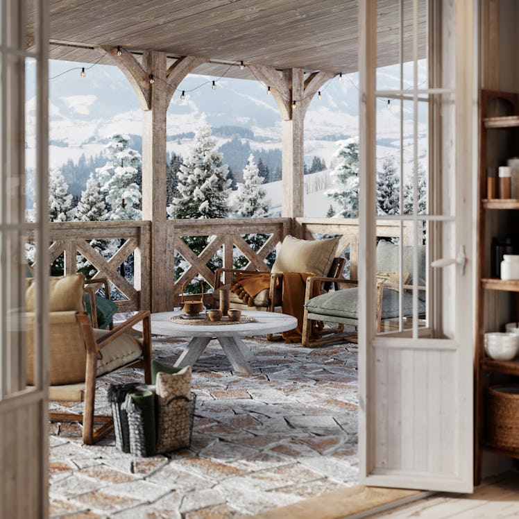 A cozy winter cottage isn't complete without lots of pillows, warm tones, and a connection to nature