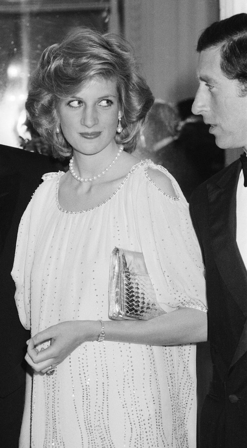 Princess Diana at a Pavarotti concert, pregnant in a white gown, 1984.