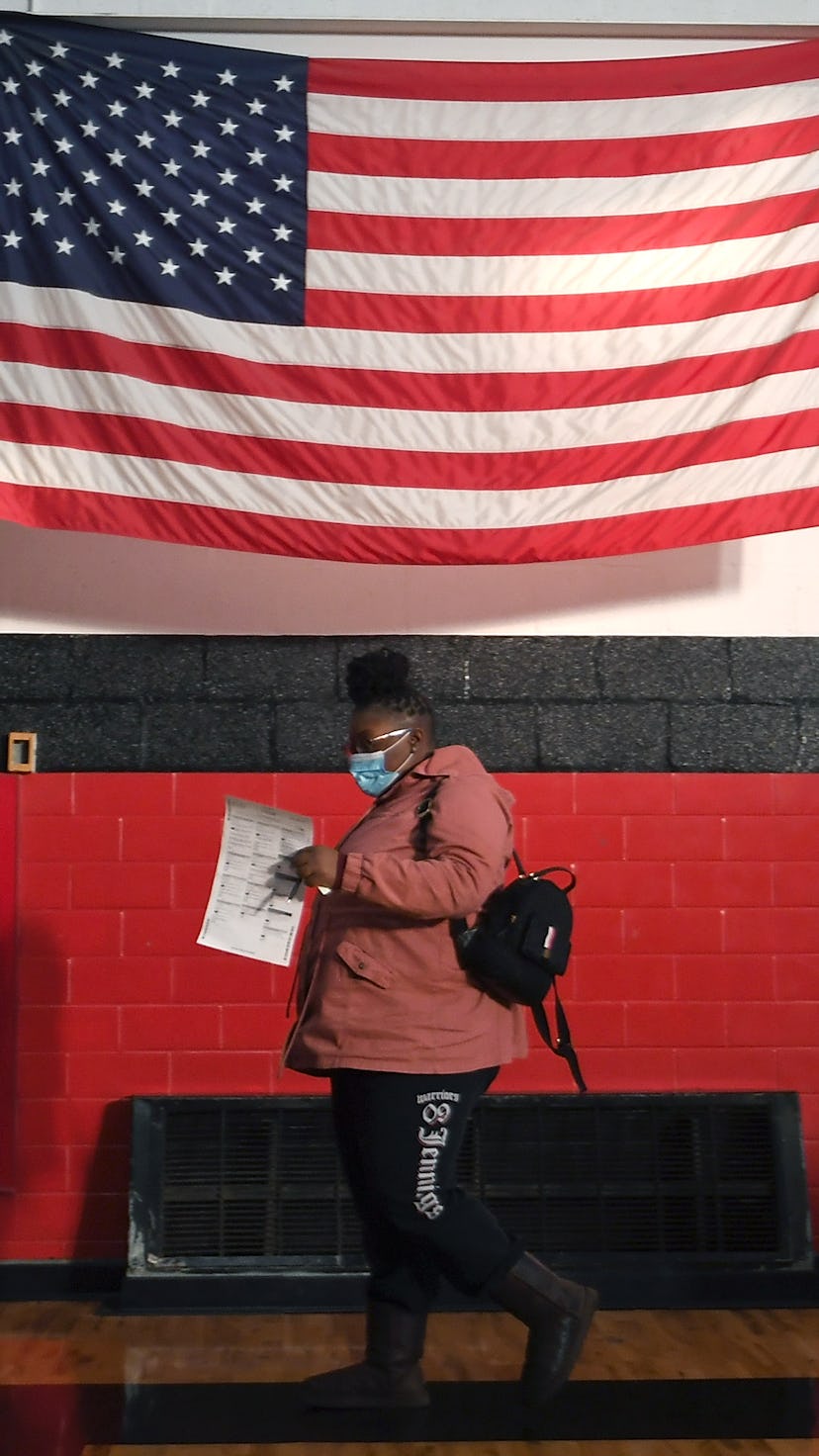 A voter casting her ballot at Jennings Senior High School in St Louis on Election Day