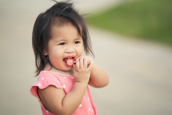 Experts explain how developmental readiness plays into deciding when babies can eat candy.