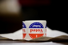 A white-red-blue mug on a desk with the text 'I Vote Today!'