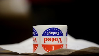 A white-red-blue mug on a desk with the text 'I Vote Today!'
