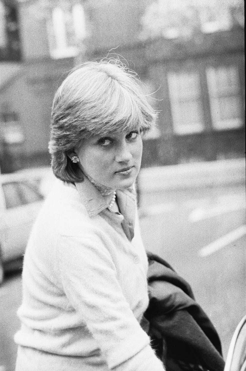 Princess Diana wears a sweater with a button down.