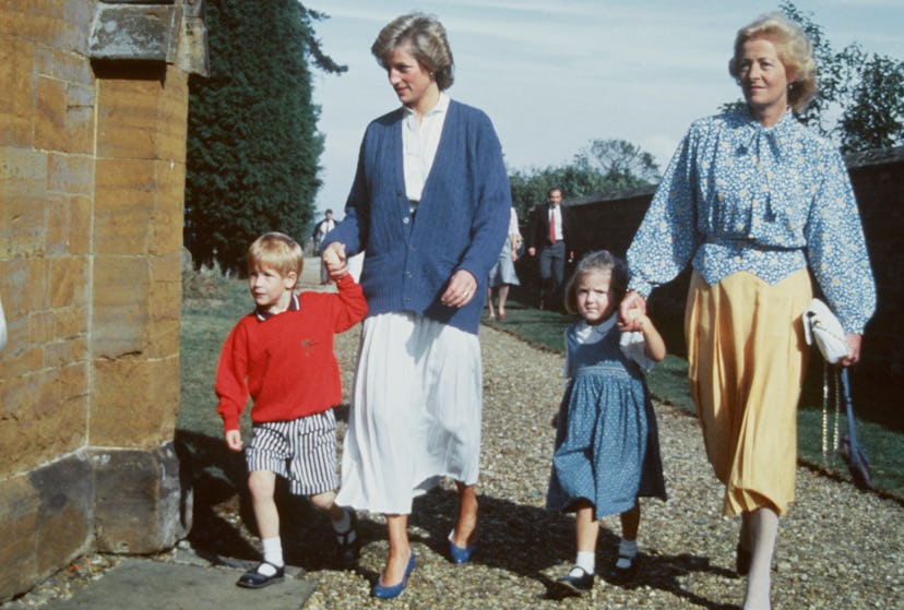 Princess Diana wears a blue cardigan.
