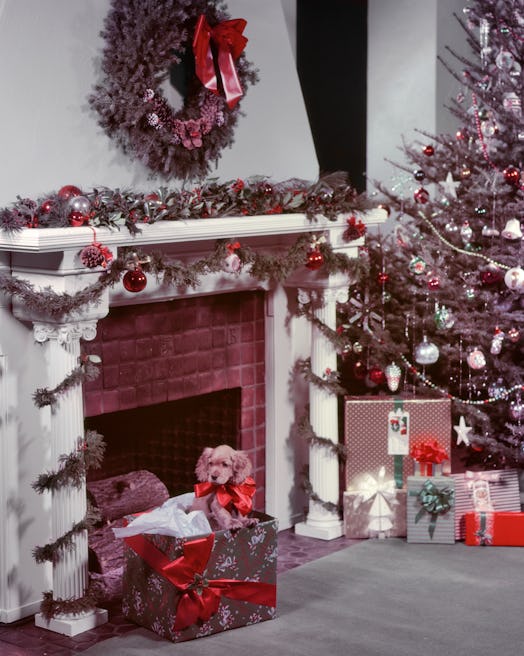 This vintage photo of Christmas decor features a tree with tinsel