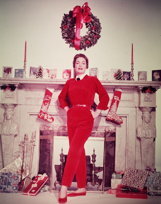 This vintage photo of Christmas decor features stockings and a card display