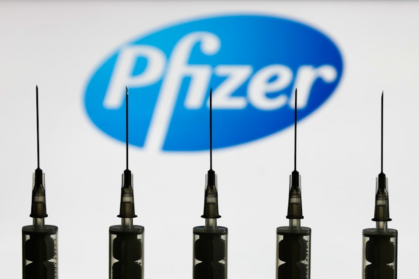 Pfizer logo with needles in front of it. 