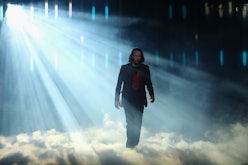 Keanu Reeves walking on stage during a Cyberpunk 2077 event