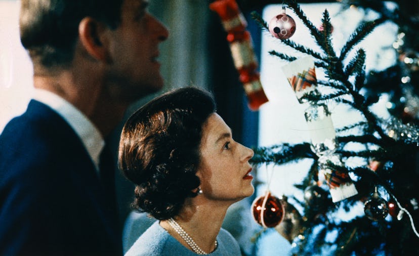 Prince Philip and Queen Elizabeth look at their Christmas tree at Buckingham Palace, 1969.