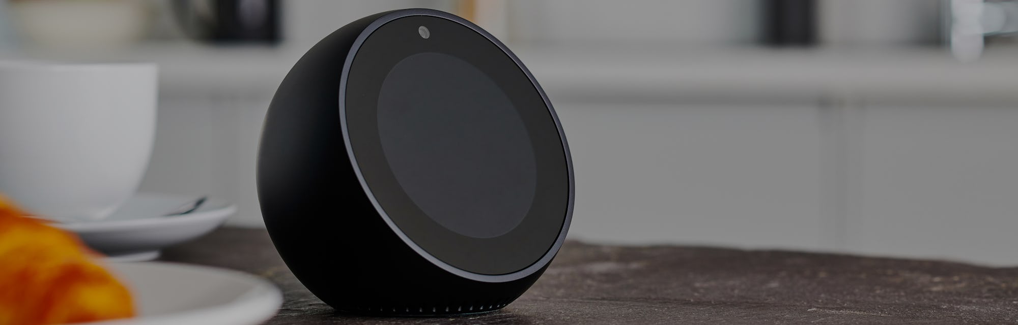 Amazon Echo Spot on a kitchen countertop.