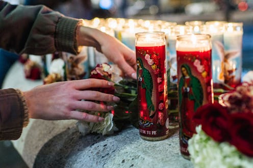 A person lights a candle for Brandon Bernard, the 10th incarcerated person to be executed under the ...
