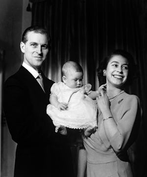 A young Queen Elizabeth II, Prince Phillip and Prince Charles as a baby in a family photo